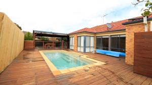 a deck with a swimming pool on a house at Sweet Home at Carrum Downs in Carrum Downs