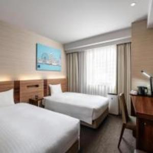 Postel nebo postele na pokoji v ubytování Noku Osaka