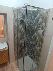 a glass cabinet with a bunch of plants on it at Chiarù in Naples +28 photos