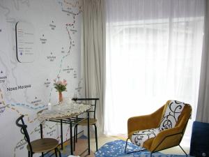 a dining room with a table and two chairs at Czarna Góra- Biała Perła z mini aneksem - 403 in Sienna