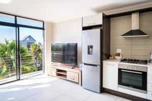 Kuchyň nebo kuchyňský kout v ubytování Canalside Tranquility