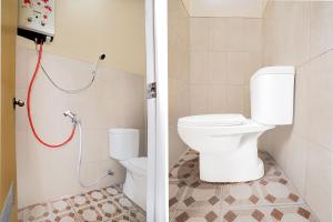 Koupelna v ubytování Hotel O Arjuna Guest House Syariah