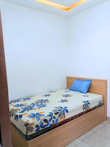 Ένα ή περισσότερα κρεβάτια σε δωμάτιο στο Casa Bella Homestay