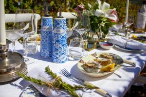 a blue and white table with a plate of food at The Alexander Estate in Noordhoek