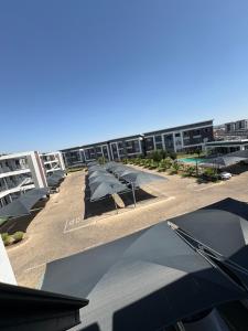 a row of umbrellas on the roof of a building at Haven & Beyond in Gaborone