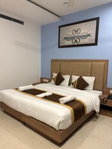 Ένα ή περισσότερα κρεβάτια σε δωμάτιο στο Silver Bell Lawn & Stay