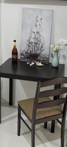 a black desk with a picture of a ship on it at Azure Edge in Dauis