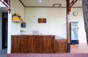 a wooden podium in a room with a clock on the wall at Pondok Tegal Tunon Villa Ubud Bali in Ubud +41 photos