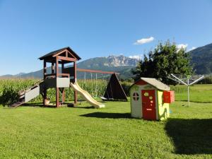 a park with a playground with a slide and a play structure at Nico's Place in Jenig