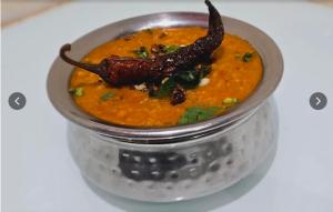 a jar of food with aiety of food in it at Hotel International, Kolhapur in Kolhapur