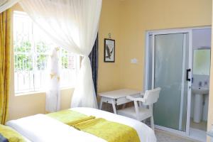 Ένα ή περισσότερα κρεβάτια σε δωμάτιο στο Aggie's BnB