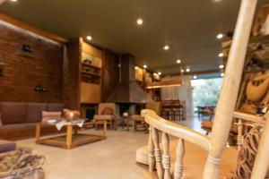 a living room with a couch and a fireplace at Retro House in Rafina +24 photos