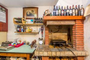 a kitchen with a brick fireplace with a counter top at Apartments in Starigrad kod Senja 27140 in Starigrad