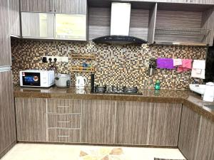 Kuchyň nebo kuchyňský kout v ubytování Harryna Homestay Damansara Damai + 2 fotografie