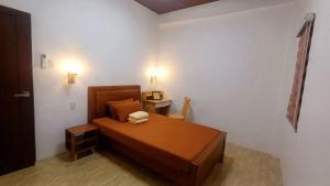 Postel nebo postele na pokoji v ubytování The Simple Farm House with a Roofdeck - Entire house, Santa Rosa, San Juan, LU