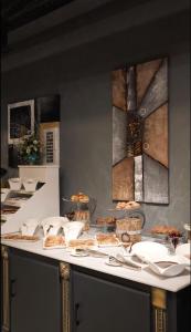 a table with plates of food on top of it at Alis Business Hotel baku in Baku