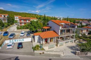 an aerial view of a town with cars parked in a parking lot at Apartment in Crikvenica 34973 in Sopaljska +3 photos