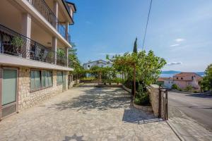 an empty street in front of a building at Apartment in Crikvenica 34973 in Sopaljska