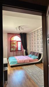 Postel nebo postele na pokoji v ubytování Гостевой дом