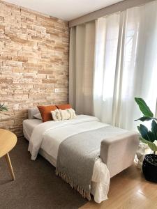 Ένα ή περισσότερα κρεβάτια σε δωμάτιο στο Apartamento Brisas