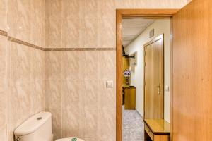 a bathroom with a white toilet in a room at Hostal la Barretina in Figueres +64 photos