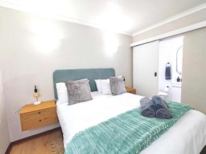 Ένα ή περισσότερα κρεβάτια σε δωμάτιο στο Ocean Blue Stay