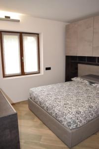 Postel nebo postele na pokoji v ubytování Baita Valtellina -Relax nel cuore delle alpi-