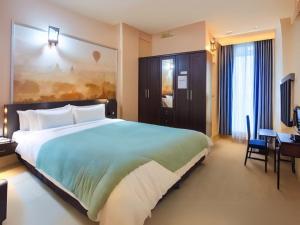 Ένα ή περισσότερα κρεβάτια σε δωμάτιο στο Ban Chang Pet-Friendly Hotel