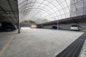 a large parking garage with cars parked in it at Jeonju Nabi in Jeonju