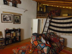 a living room with a couch and a bunk bed at Casa da Tartaruga - Marvão in Santo António das Areias