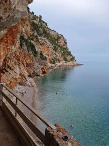 a view of a beach with people swimming in the water at Apartment in Rovinj - Istrien 43942 in Štanga