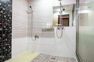 a shower with a glass door in a bathroom at Jeonju Nabi in Jeonju +21 photos