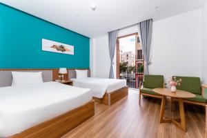 Ένα ή περισσότερα κρεβάτια σε δωμάτιο στο Mimosa Hotel Phú Quốc