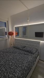 Ένα ή περισσότερα κρεβάτια σε δωμάτιο στο Comfort zivinice