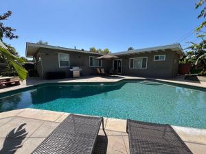 a swimming pool in front of a house at Destination #12 in Anaheim
