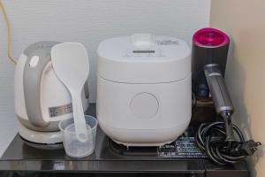 a counter with a food processor and a mixer on it at 3 minutes walk from Minami Fukuoka Station, free Wi-Fi in Fukuoka