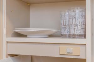 a shelf with a bowl and a glass on it at 3 minutes walk from Minami Fukuoka Station, free Wi-Fi in Fukuoka +18 photos