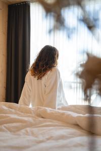 En eller flere senge i et værelse på Preindlerhof Farmloft Sunshine