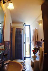 a bathroom with a sink and a toilet and a shower at Palazzo Angelelli in Gallipoli