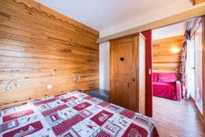 Ένα ή περισσότερα κρεβάτια σε δωμάτιο στο A2 309 Appart au pied des pistes