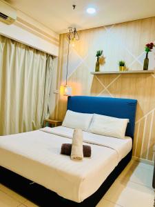 Ένα ή περισσότερα κρεβάτια σε δωμάτιο στο Summer Suites klcc by classy stay