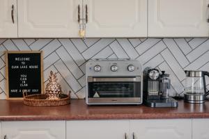 a kitchen counter with a toaster oven on a counter at Clanwilliam Dam House in Clanwilliam