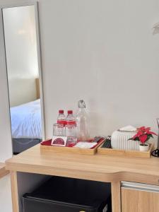 Postel nebo postele na pokoji v ubytování ปิกรพลอย บูทีค โฮเทล PIKORNPLOY Boutique Hotel