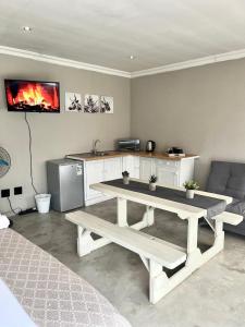 a living room with a table and a couch at OR Tambo Stay Unit 1 in Boksburg