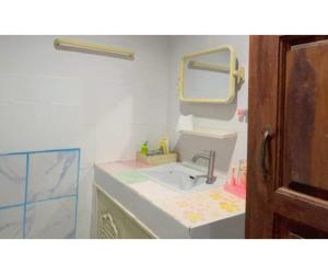 a bathroom with a sink and a mirror at OYO 75596 The Sirisuk House in Ban Nong Nae +22 photos