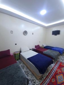 Voodi või voodid majutusasutuse Dar Kawtar toas +47 fotot