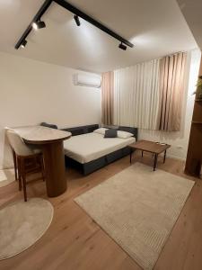 Postel nebo postele na pokoji v ubytování Modern Bazaar Apartment