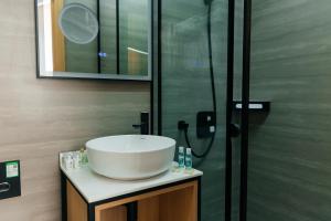 a bathroom with a sink and a shower at Samovar in Petropavlovsk