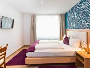 Llit o llits en una habitació de Hotel Sarah
