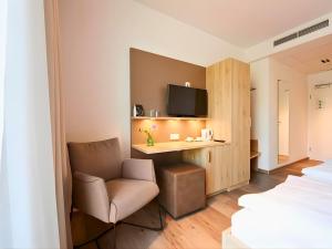 TV a/nebo společenská místnost v ubytování Hotel Sarah